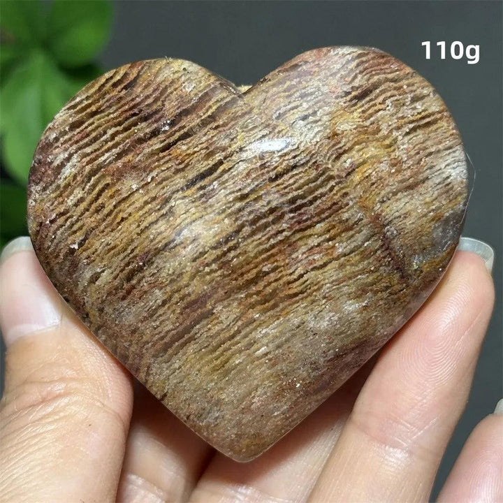 110g Natural Garden Thousand-Layer crystal heart for Feng Shui, featuring earthy banded patterns for healing and meditation.