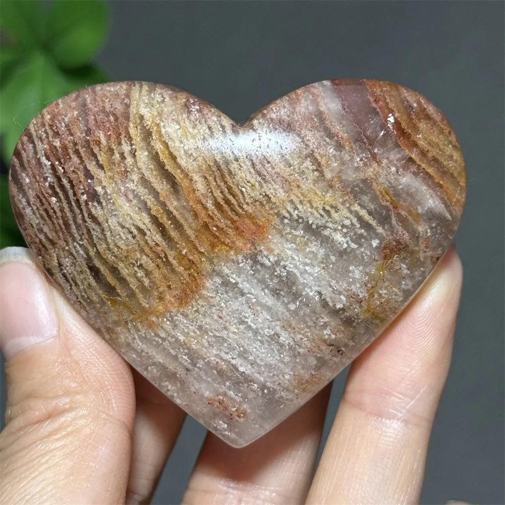 Polished thousand-layer crystal heart ornament with natural earthy bands for healing, meditation, and auspicious decor.