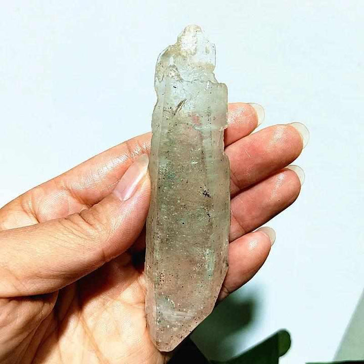Polished Garden and Strawberry Quartz point featuring mossy green inclusions and red flecks for heart chakra healing.