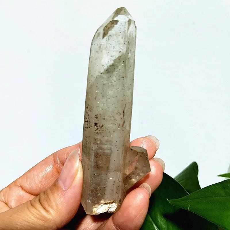 Polished Garden and Strawberry Quartz crystal point featuring mossy green inclusions and red flecks for heart chakra healing.
