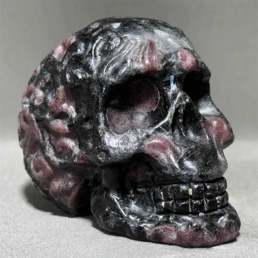 Hand-carved Garnet Skull featuring deep red crystals in natural gray host stone for root and heart chakra energy.