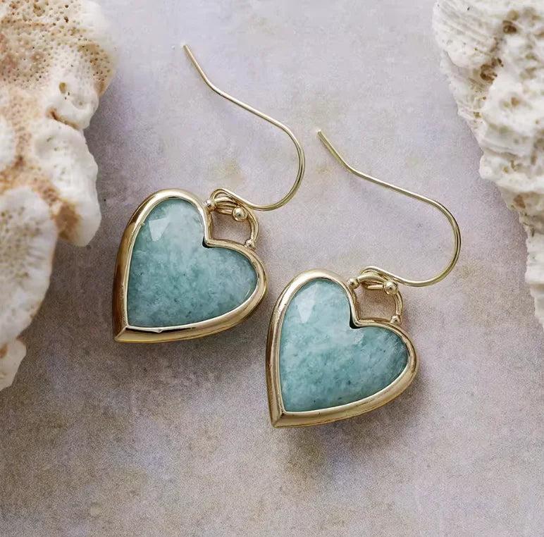 Heart-shaped Amazonite gemstone earrings in gold settings, offering calming energy in a stylish drop design.