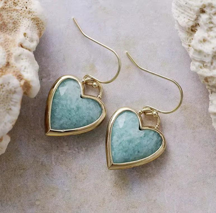 Heart-shaped Amazonite gemstone earrings in gold settings, offering calming energy in a stylish drop design.