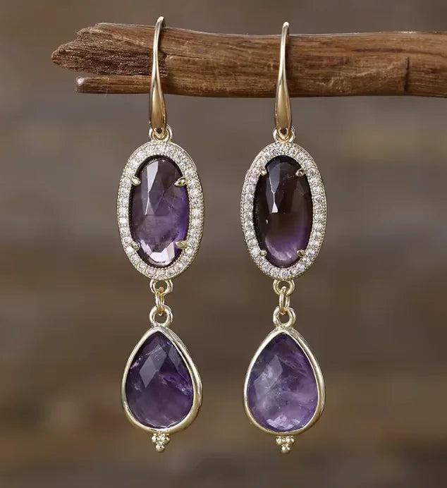 Amethyst Gemstone Crystal Earrings featuring elegant purple teardrop and oval stones set in gold for calming energy.