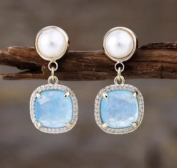 Aquamarine drop earrings with pearl studs and crystal halos, perfect for calming energy and elegant healing style.