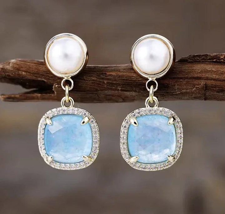 Aquamarine drop earrings with pearl studs and crystal halos, perfect for calming energy and elegant healing style.
