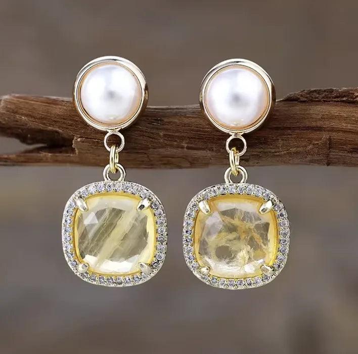Citrine gemstone drop earrings with pearl accents and sparkling halo settings for radiant healing energy.