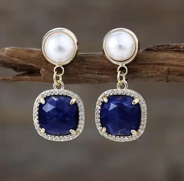 Lapis Lazuli Gemstone Crystal Earrings featuring deep blue square stones, pearl accents, and gold-tone settings.