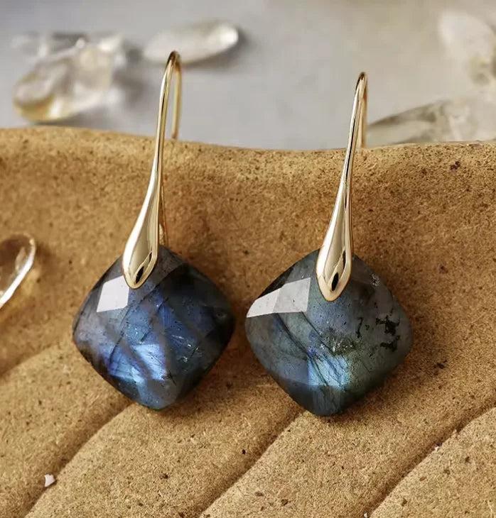 Labradorite gemstone drop earrings featuring faceted square stones and gold hooks for intuitive healing energy.