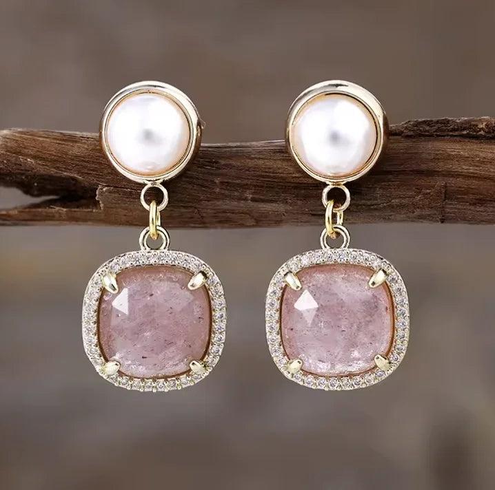 Strawberry Quartz drop earrings with pearl accents, set in gold with sparkling halo frames for heart chakra energy.
