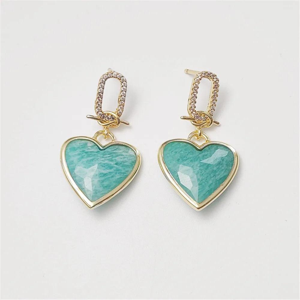Amazonite heart stud earrings in gold-plated copper, featuring faceted teal stones for heart chakra energy and elegance.