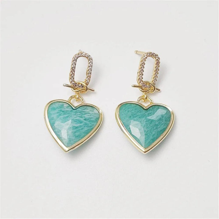 Amazonite heart stud earrings in gold-plated copper, featuring faceted teal stones for heart chakra energy and elegance.