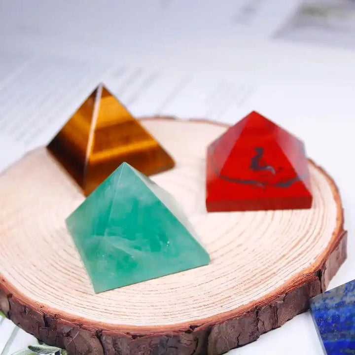 Polished Gemstone Mini Pyramids in tiger eye, red jasper, and green fluorite for energy focus and chakra healing.