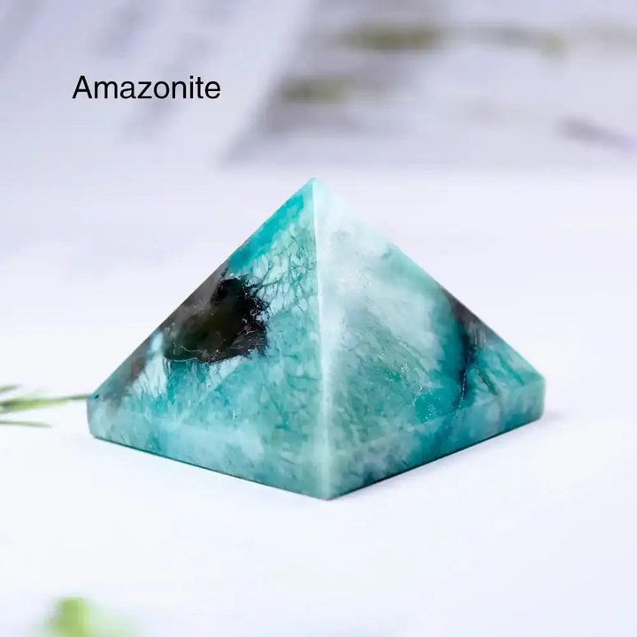 Polished Amazonite mini gemstone pyramid with vibrant teal hues, perfect for focusing intention and chakra healing.