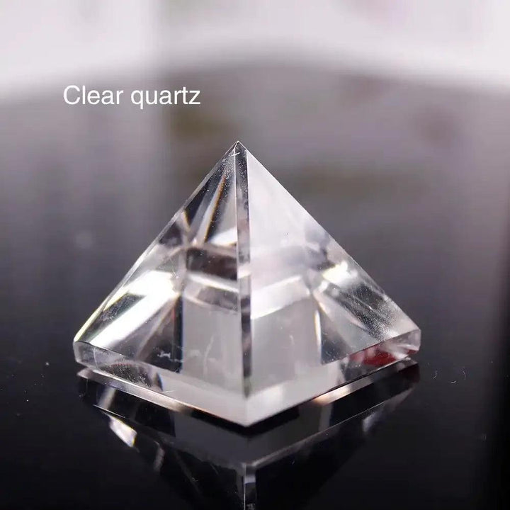 Clear quartz mini gemstone pyramid, a hand-polished 30mm crystal for Crown chakra healing and focused intention.