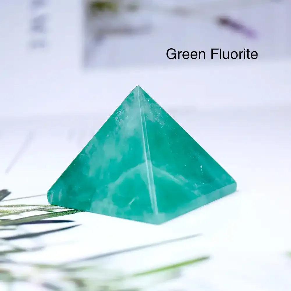 Polished green fluorite mini gemstone pyramid, a 30mm sacred geometry crystal for focus and chakra balancing.