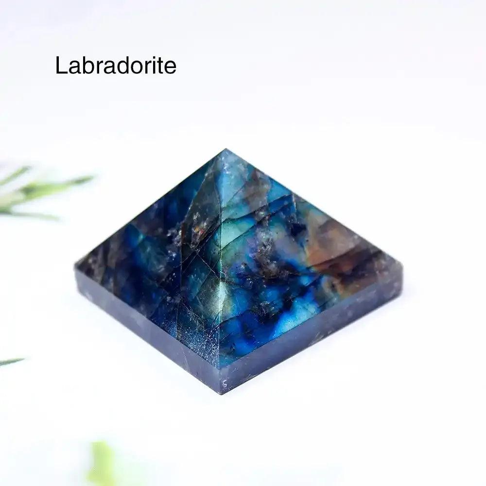 Polished 30mm Labradorite gemstone mini pyramid with iridescent blue flashes for focused intention and energy healing.