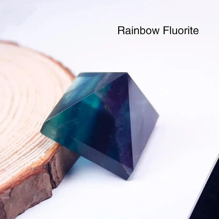 Polished Rainbow Fluorite mini gemstone pyramid with vibrant purple and green hues for focused intention and healing.