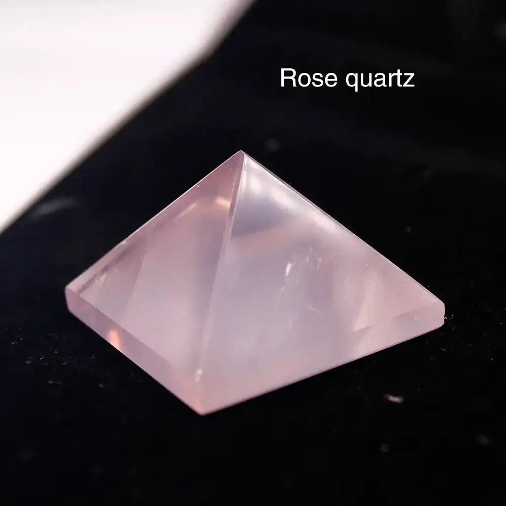 Polished rose quartz mini pyramid, a 30mm sacred geometry crystal for heart chakra healing and love energy.