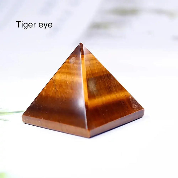 Polished Tiger Eye gemstone mini pyramid, 30mm, featuring golden-brown bands for grounding and intentional focus.