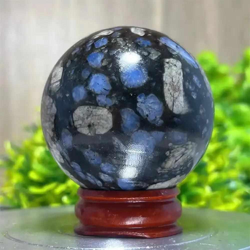 Polished Glaucophane sphere with blue and grey mineral inclusions, perfect for Reiki healing and spiritual home decor.