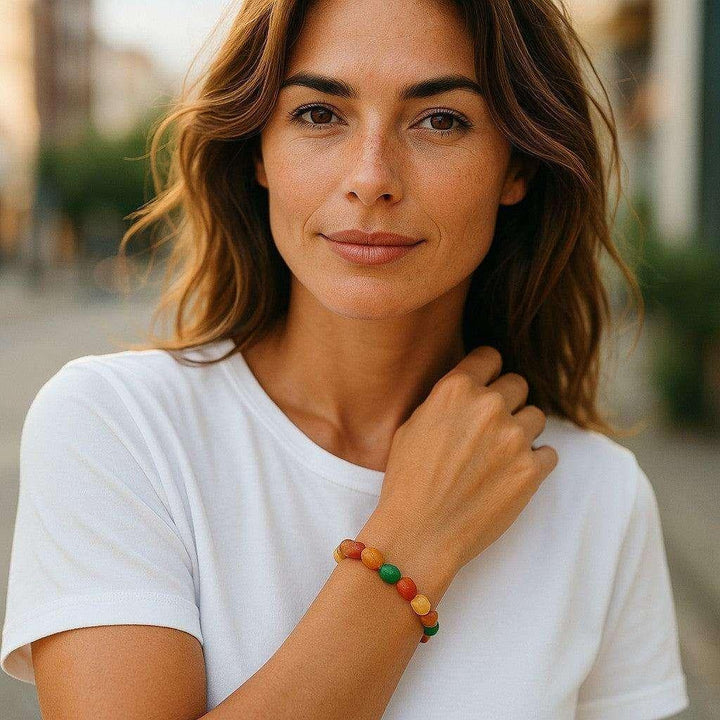 Woman wearing a Gobi Desert Agate Crystal Beaded Bracelet with earthy reds, oranges, yellows, and creams for grounding.