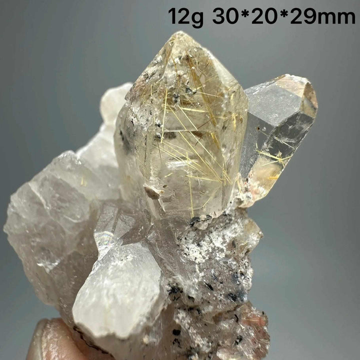 Gold rutilated quartz and specular hematite specimen with golden needles and metallic sheen for solar plexus healing.