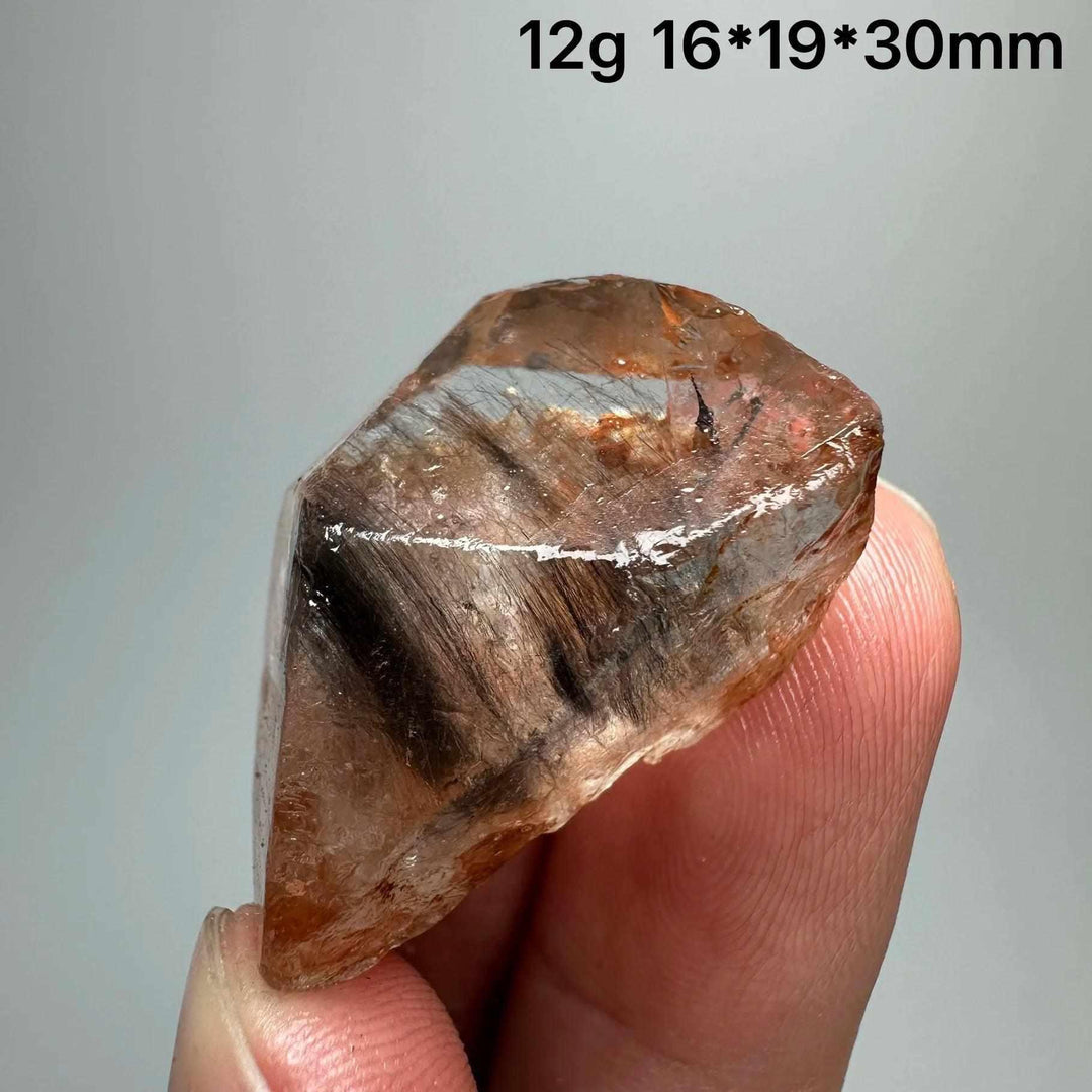 Gold rutilated quartz and specular hematite specimen with metallic needles, perfect for Solar Plexus and Root chakra healing.