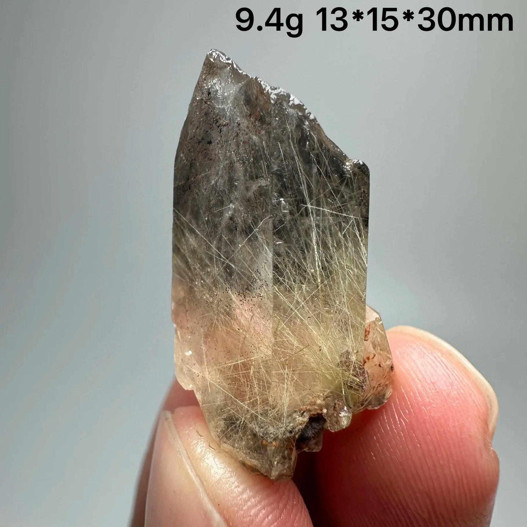 Gold Rutilated Quartz and Specular Hematite specimen featuring golden needles and metallic sheen for chakra healing.