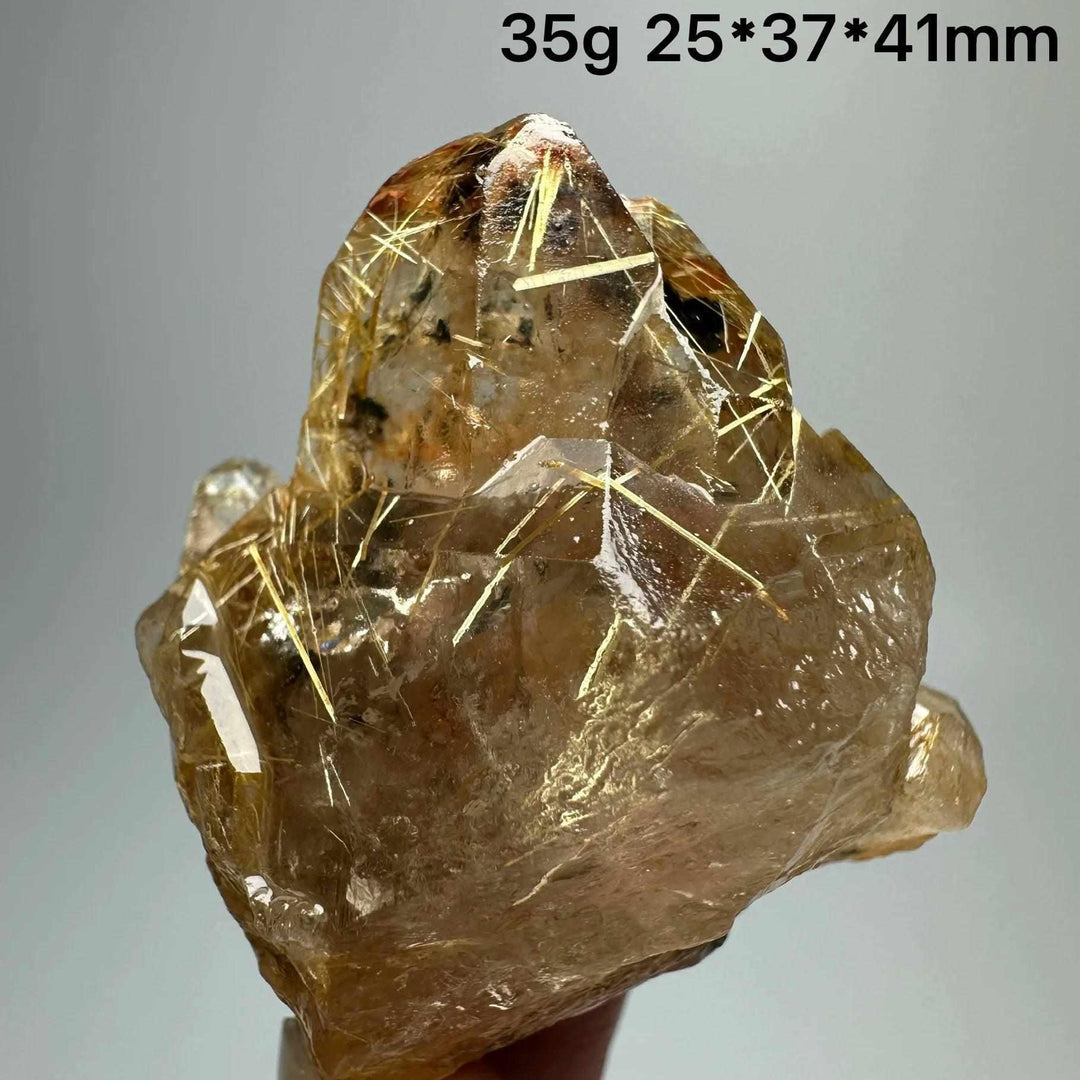 Gold rutilated quartz and specular hematite specimen with golden needles, grounding Solar Plexus and Root chakra energy.
