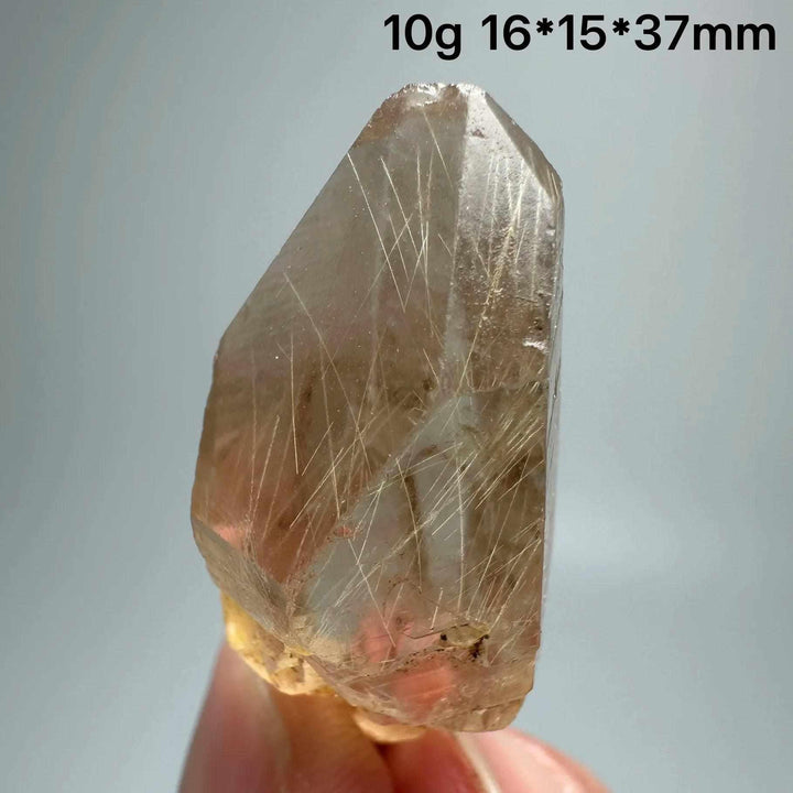 Gold rutilated quartz and specular hematite specimen with golden needles, 10g, 16x15x37mm, for solar plexus and root chakras.
