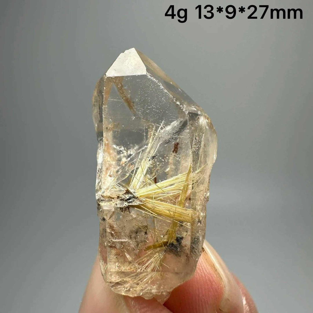 Gold rutilated quartz and specular hematite specimen with golden needles and metallic sheen for solar plexus healing.