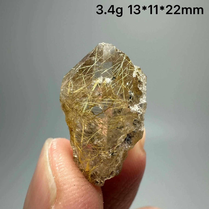 Gold rutilated quartz and specular hematite specimen with golden needles, perfect for solar plexus and root chakra healing.