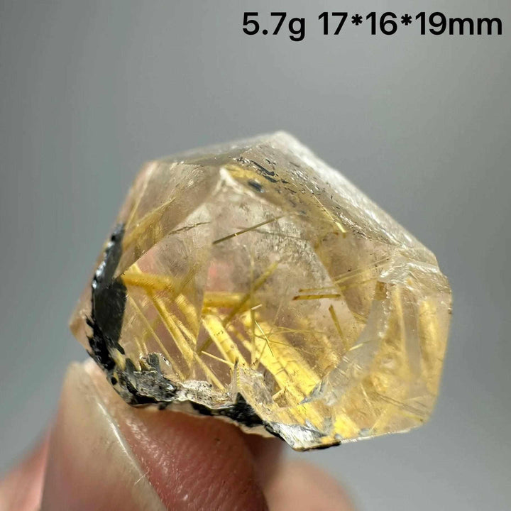 Gold rutilated quartz specimen with metallic specular hematite, featuring golden needles for solar plexus healing.