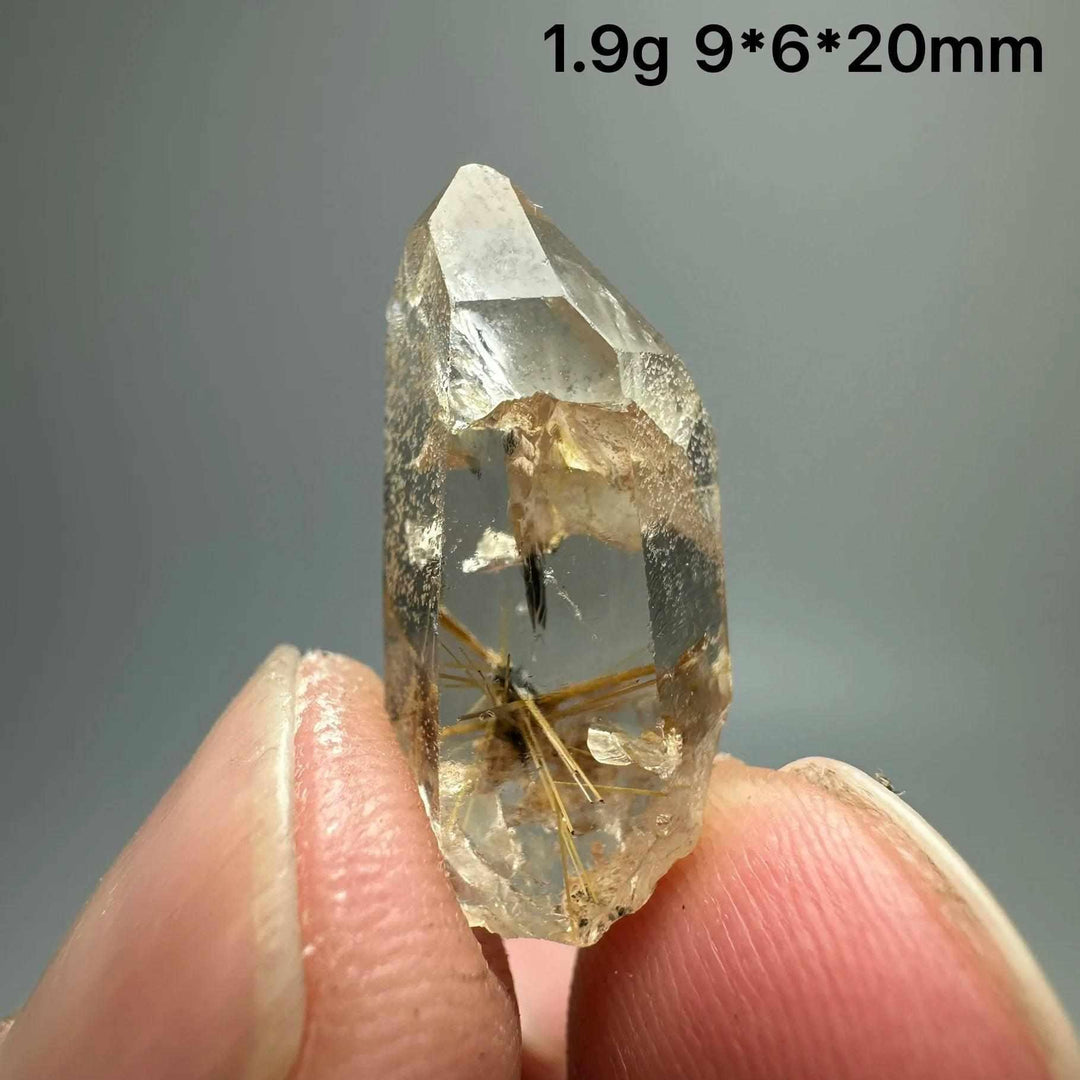 Gold rutilated quartz and specular hematite crystal point with golden needles, 20mm, for solar plexus and root chakra.