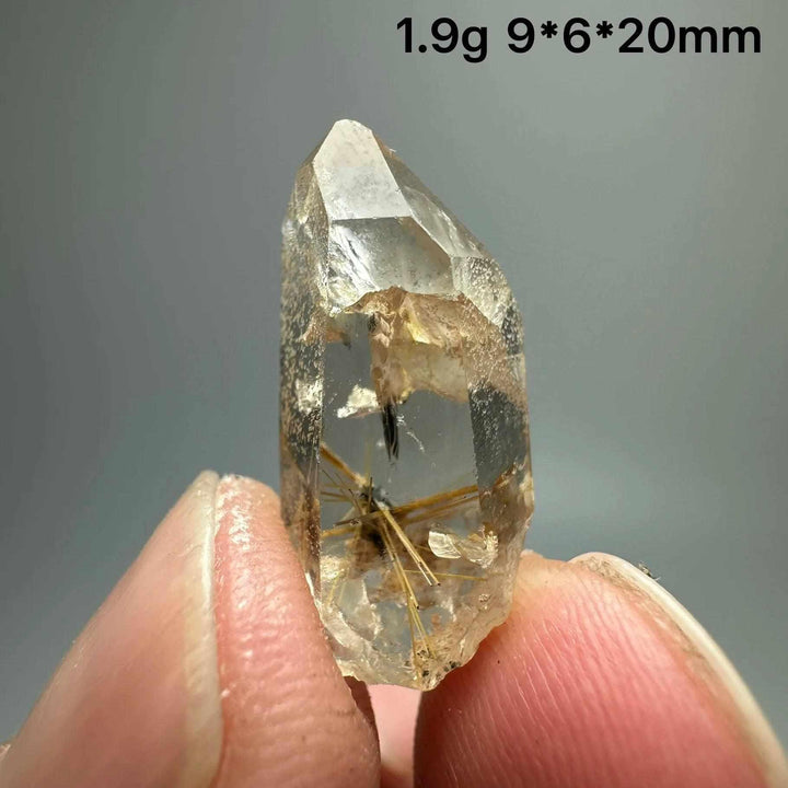 Gold rutilated quartz and specular hematite crystal point with golden needles, 20mm, for solar plexus and root chakra.