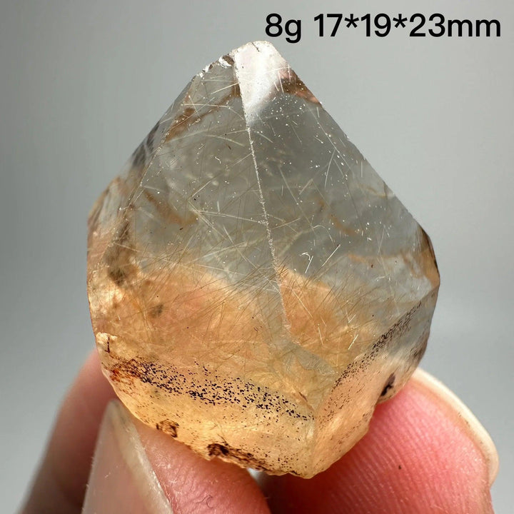 Natural Brazil Gold Rutilated Quartz crystal, 8g, 17x19x23mm, with hair-like inclusions and specular hematite.