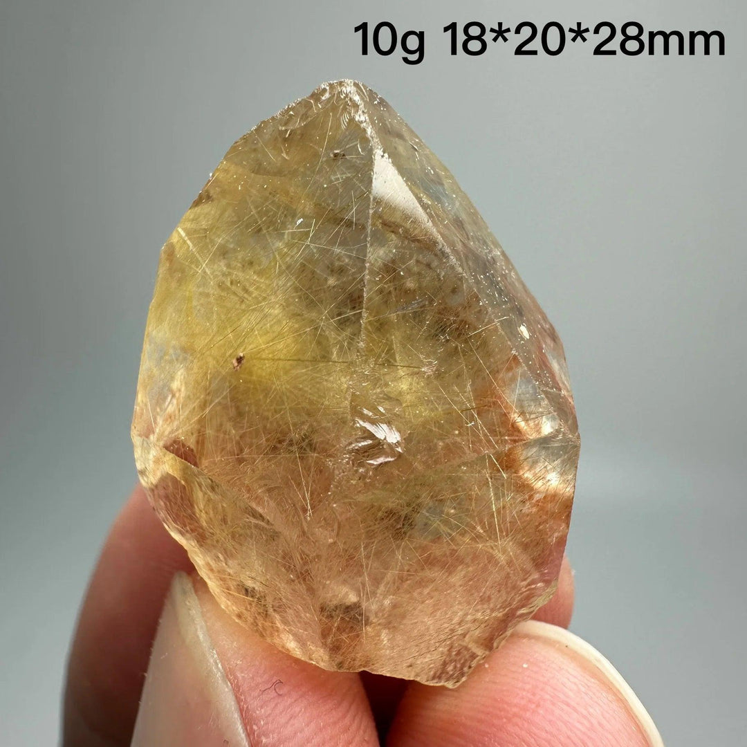 Natural Brazil Gold Rutilated Quartz crystal, 10g, with hair-like inclusions and specular hematite.