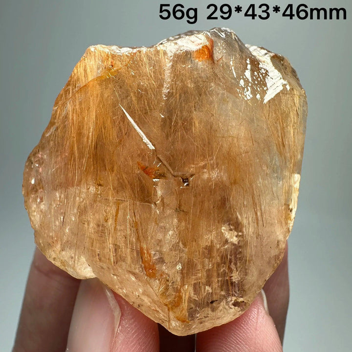 Natural Brazil Gold Rutilated Quartz crystal specimen, 56g, with golden hair-like inclusions and specular hematite.