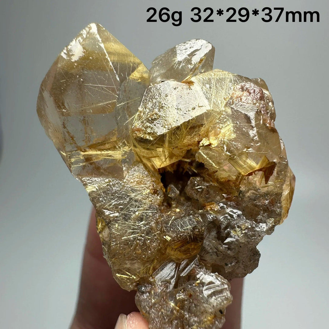 Natural Brazil Gold Rutilated Quartz crystal with hair-like inclusions and specular hematite, 26g specimen.