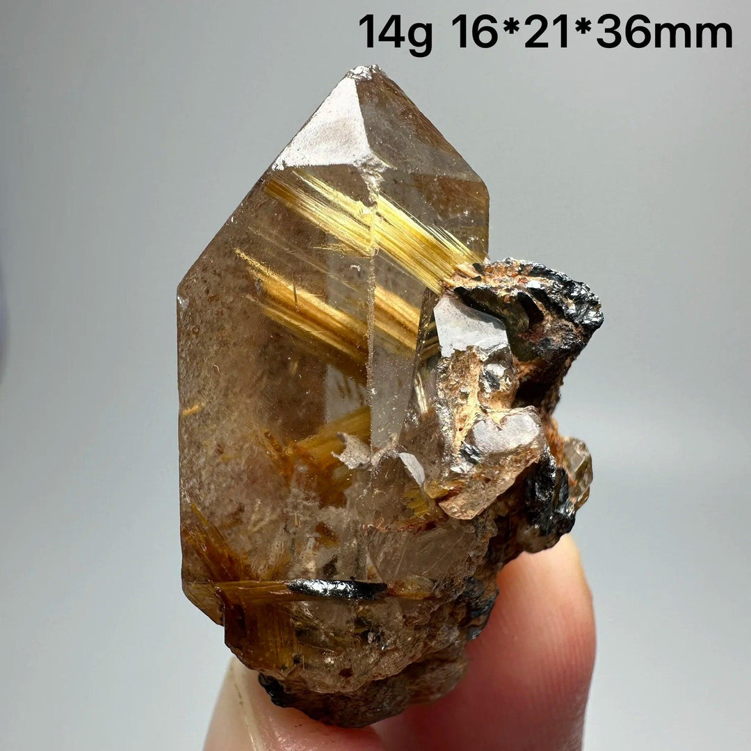Natural Brazil Gold Rutilated Quartz crystal with golden rutile needles and dark specular hematite, 14g.