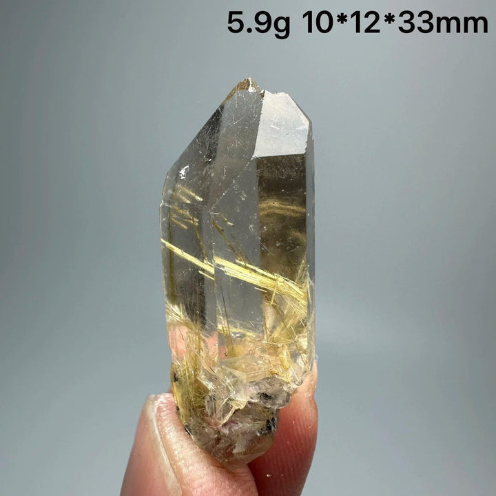 Natural Brazil Gold Rutilated Quartz crystal, 5.9g, 10x12x33mm, with golden rutile inclusions.
