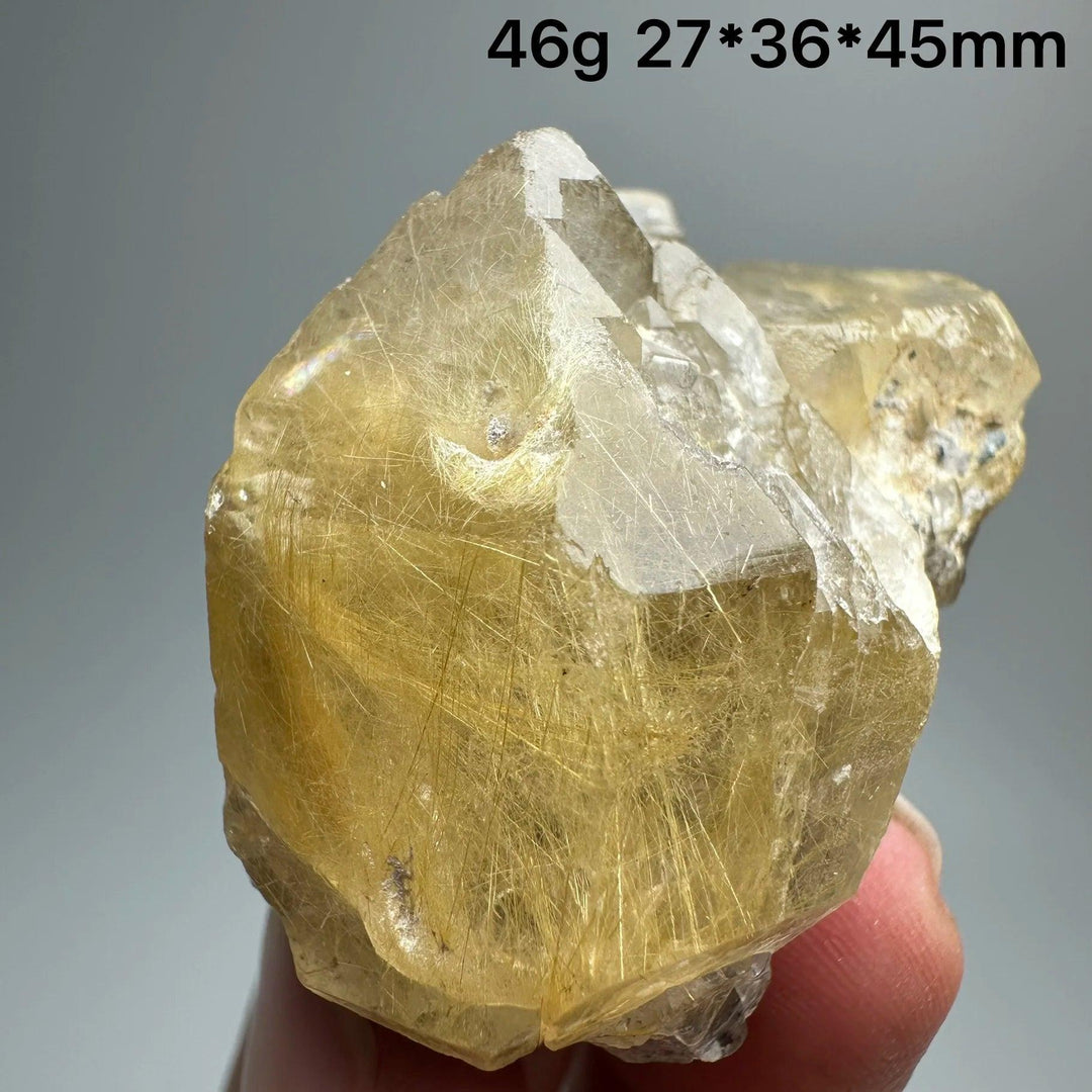 Natural Brazil Gold Rutilated Quartz crystal specimen, 46g, with golden hair-like inclusions and clear facets.