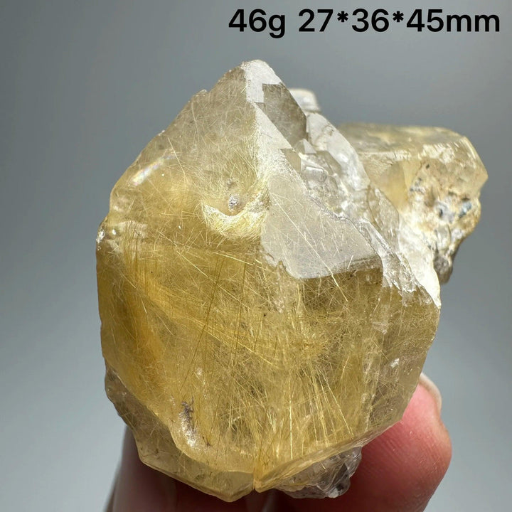 Natural Brazil Gold Rutilated Quartz crystal specimen, 46g, with golden hair-like inclusions and clear facets.