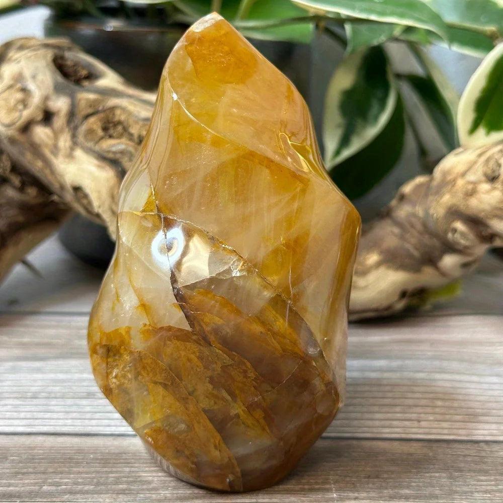 Golden Healer Quartz Crystal Carved Flame: Warm amber gold, glowing with iron oxide inclusions, activating solar plexus.
