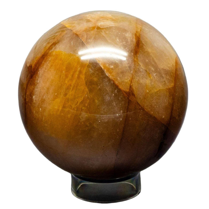 Polished Ferruginous Golden Healer Quartz Sphere, 75-77mm, showcasing warm golden-yellow hues from iron oxide.