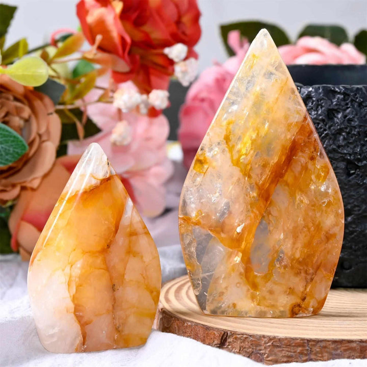 Two polished Golden Healer Quartz teardrop freeforms with warm yellow tones, perfect for uplifting altar decor.
