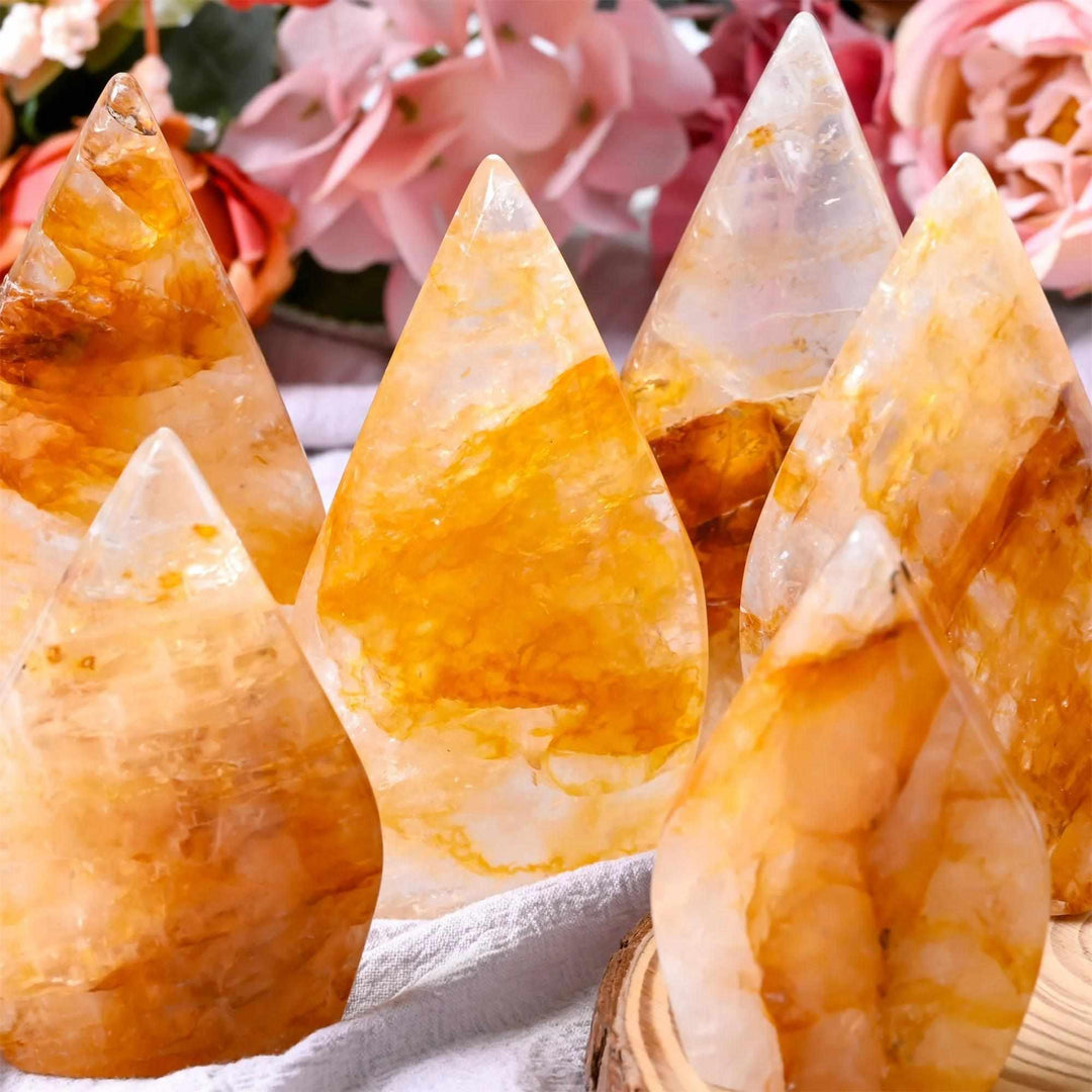 Polished Golden Healer Quartz teardrop freeforms with glowing yellow tones for uplifting Solar Plexus chakra energy.