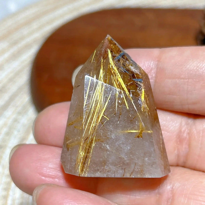 Hand-polished Golden Rutilated Quartz tower with brilliant golden needles, perfect for focus and energy amplification.