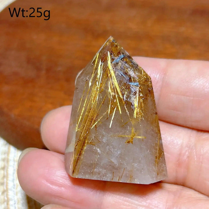 Hand-polished Golden Rutilated Quartz tower featuring clear crystal with fine golden rutile needles for amplified energy.